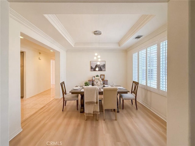 43097 Calle Camellia, Temecula, CA 92592 - dining space featuring ornamental molding, light wood-style flooring, and a raised ceiling