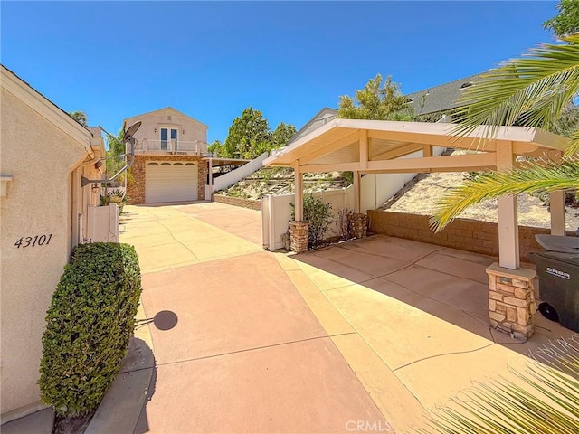 43097 Calle Camellia, Temecula, CA 92592 - view of patio / terrace with an attached garage and driveway
