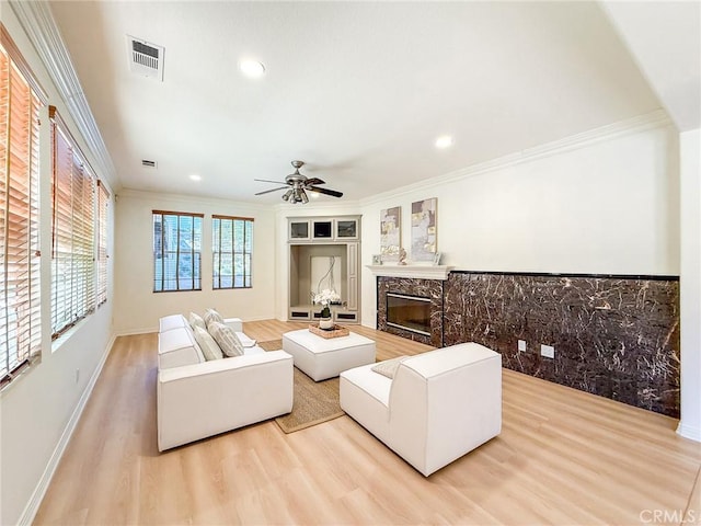 43097 Calle Camellia, Temecula, CA 92592 - living area featuring crown molding, wood finished floors, recessed lighting, ceiling fan, and a fireplace