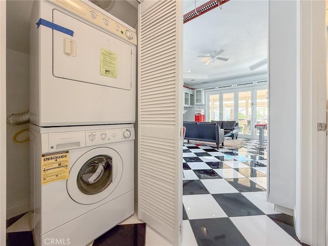43097 Calle Camellia, Temecula, CA 92592 - laundry room featuring stacked washer / drying machine, a ceiling fan, tile patterned floors, and crown molding