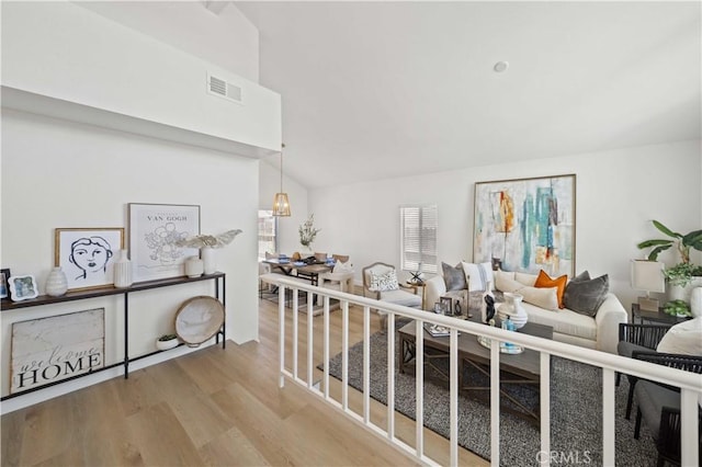 2143 Westminster Dr, Palmdale, CA 93550 - living area featuring wood finished floors and lofted ceiling