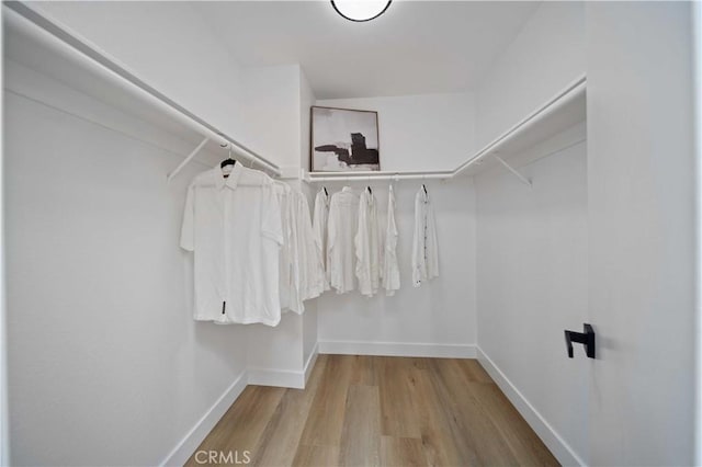 2143 Westminster Dr, Palmdale, CA 93550 - walk in closet featuring wood finished floors