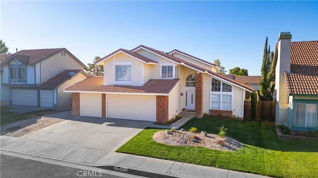 2143 Westminster Dr, Palmdale, CA 93550 - traditional-style home featuring a tiled roof, concrete driveway, brick siding, and an attached garage