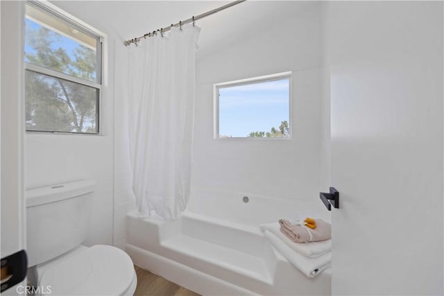2143 Westminster Dr, Palmdale, CA 93550 - bathroom with shower / bath combination with curtain and wood finished floors