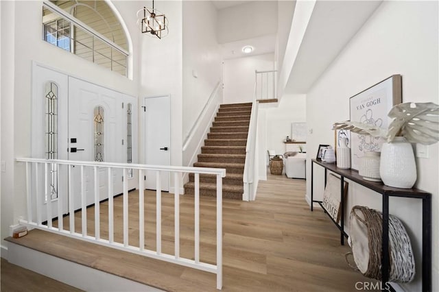 2143 Westminster Dr, Palmdale, CA 93550 - foyer entrance featuring wood finished floors, stairs, a towering ceiling, and a chandelier