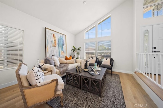 2143 Westminster Dr, Palmdale, CA 93550 - living room featuring wood finished floors and high vaulted ceiling