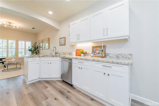 5 Bretagne, Newport Coast, CA 92657 - kitchen with stainless steel dishwasher, a peninsula, white cabinets, and recessed lighting