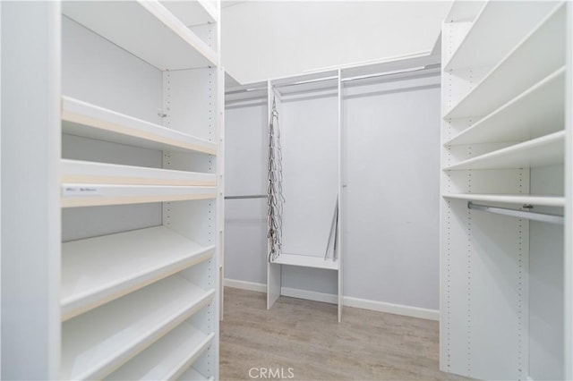 5 Bretagne, Newport Coast, CA 92657 - walk in closet featuring wood finished floors
