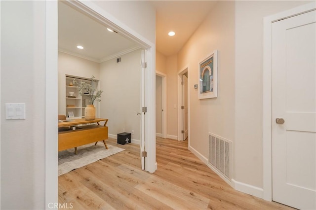 5 Bretagne, Newport Coast, CA 92657 - hallway featuring light wood finished floors, ornamental molding, recessed lighting, and a desk