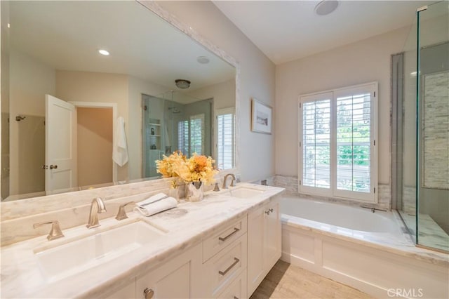 5 Bretagne, Newport Coast, CA 92657 - bathroom with a garden tub, a shower stall, double vanity, and wood finished floors