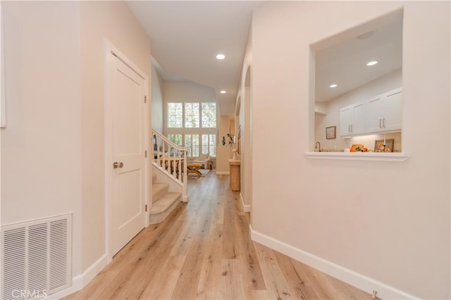 5 Bretagne, Newport Coast, CA 92657 - hall featuring light wood-type flooring, recessed lighting, and stairs