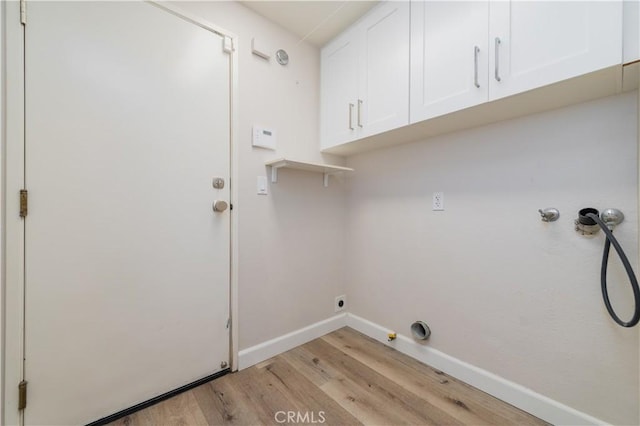 5 Bretagne, Newport Coast, CA 92657 - laundry area featuring cabinet space, gas dryer hookup, light wood-type flooring, and washer hookup