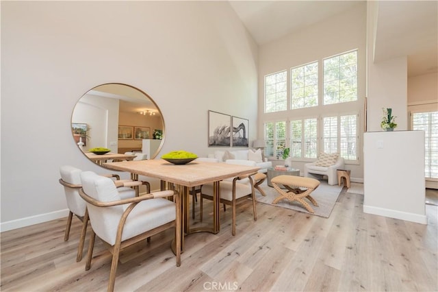 5 Bretagne, Newport Coast, CA 92657 - dining room with a high ceiling, light wood-style flooring, and plenty of natural light