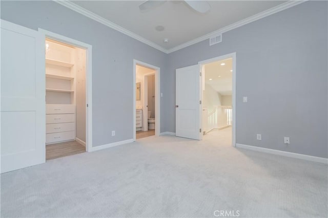 5 Bretagne, Newport Coast, CA 92657 - unfurnished bedroom featuring a spacious closet, carpet flooring, ornamental molding, ensuite bath, and a closet