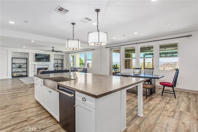 13438 Ambrosia Ct, Riverside, CA 92503 - kitchen with dishwasher, recessed lighting, dark countertops, open floor plan, and a ceiling fan