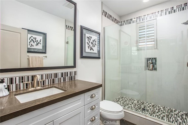 13438 Ambrosia Ct, Riverside, CA 92503 - bathroom featuring a shower stall, vanity, and tasteful backsplash