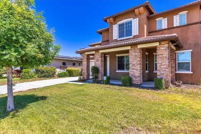 31578 Waterfall Way, Murrieta, CA 92563 - view of front of house featuring stucco siding, stone siding, a front lawn, and a tile roof
