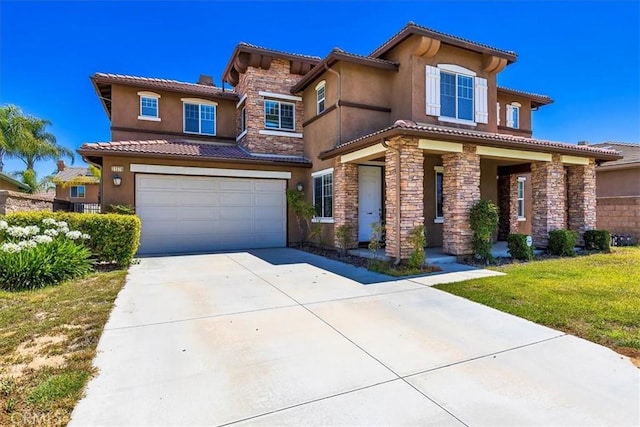 31578 Waterfall Way, Murrieta, CA 92563 - view of front of house featuring an attached garage, concrete driveway, stone siding, stucco siding, and a tile roof