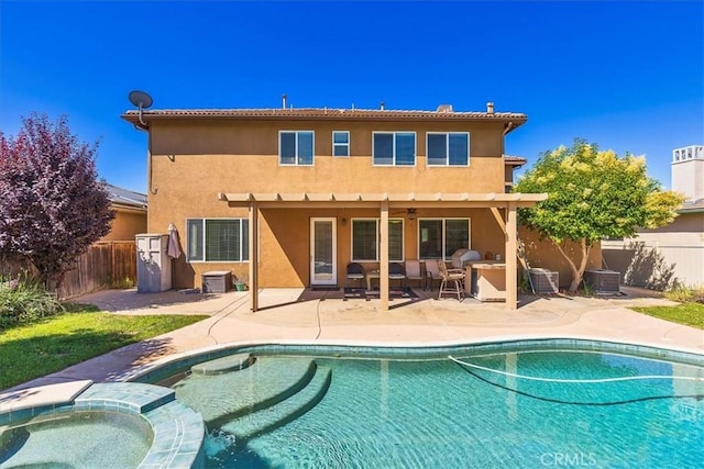 31578 Waterfall Way, Murrieta, CA 92563 - back of house featuring stucco siding, a fenced backyard, a patio area, and a pool with connected hot tub