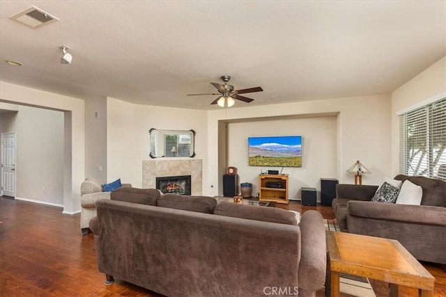 31578 Waterfall Way, Murrieta, CA 92563 - living room featuring dark wood-type flooring, a fireplace, and a ceiling fan