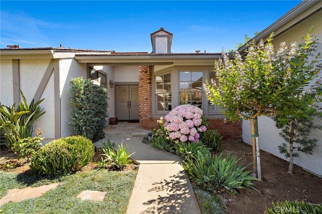 1061 Regis Way, Tustin, CA 92780 - view of exterior entry featuring stucco siding and brick siding