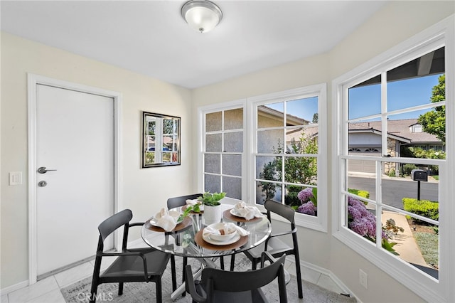 1061 Regis Way, Tustin, CA 92780 - dining space featuring healthy amount of natural light and light tile patterned floors
