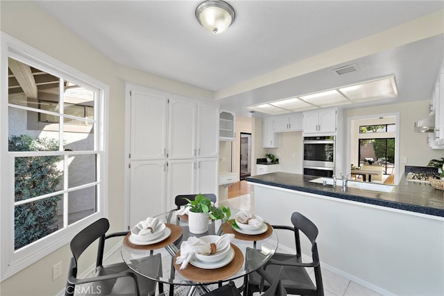 1061 Regis Way, Tustin, CA 92780 - dining room featuring light tile patterned floors and baseboards