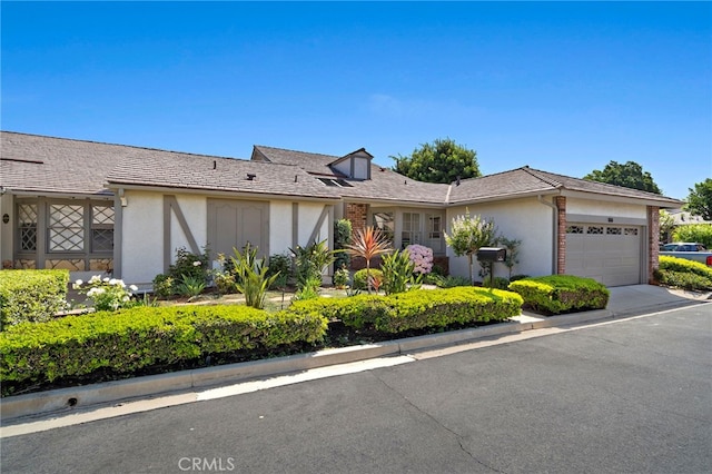 1061 Regis Way, Tustin, CA 92780 - view of front of home with stucco siding and an attached garage