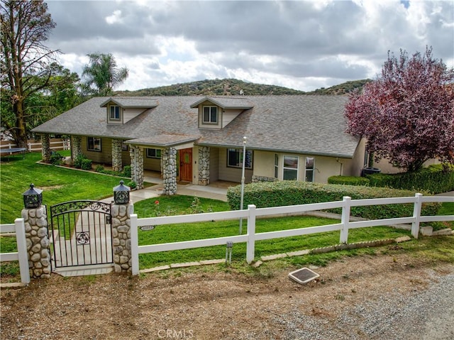 43350 Dunlap, Banning, CA 92220 - view of front of property with a fenced front yard, covered porch, roof with shingles, and a gate