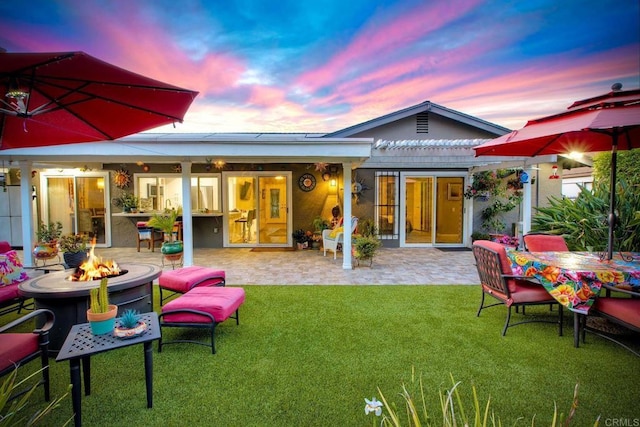 12395 Filera Rd, San Diego, CA 92128 - back of house with an outdoor fire pit, a patio, and a lawn