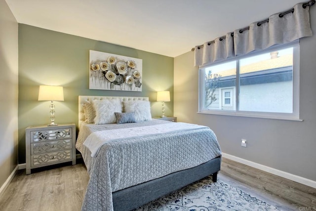12395 Filera Rd, San Diego, CA 92128 - bedroom featuring wood finished floors and baseboards