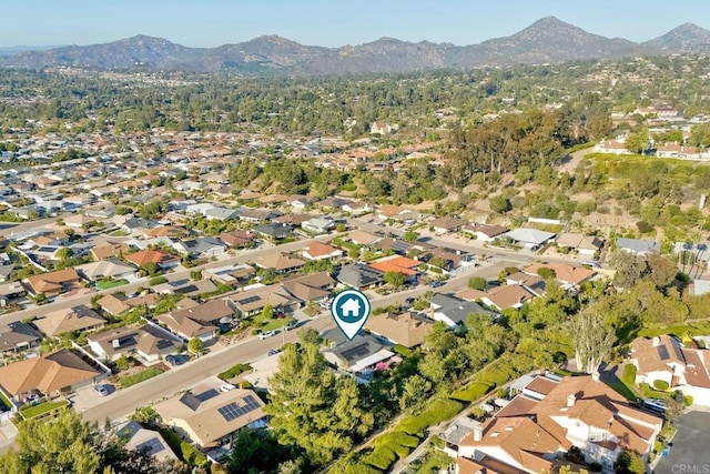 12395 Filera Rd, San Diego, CA 92128 - aerial view of property and surrounding area with a mountainous background and nearby suburban area