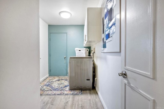 12395 Filera Rd, San Diego, CA 92128 - washroom with washer / clothes dryer, light wood-style flooring, and cabinet space