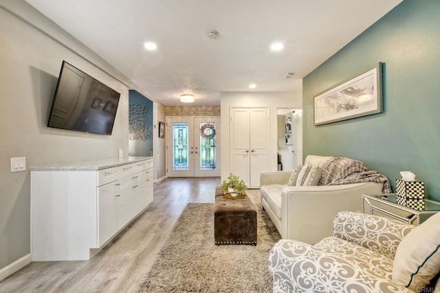 12395 Filera Rd, San Diego, CA 92128 - living room featuring french doors, light wood-style floors, and recessed lighting