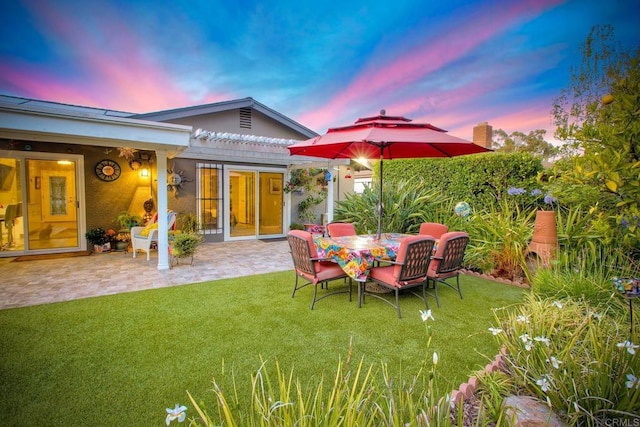 12395 Filera Rd, San Diego, CA 92128 - yard at dusk with a patio, a yard, and a pergola