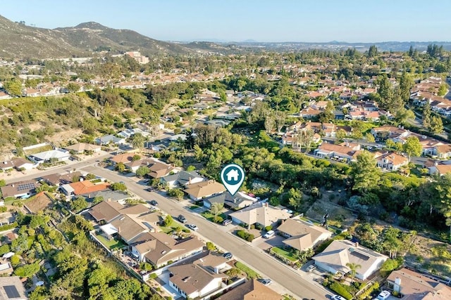 12395 Filera Rd, San Diego, CA 92128 - aerial overview of property's location with a mountain backdrop and nearby suburban area