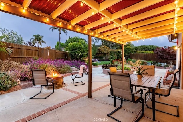 4368 Manchester Ct, Santa Maria, CA 93455 - fenced backyard featuring a fire pit, a patio area, and outdoor dining space
