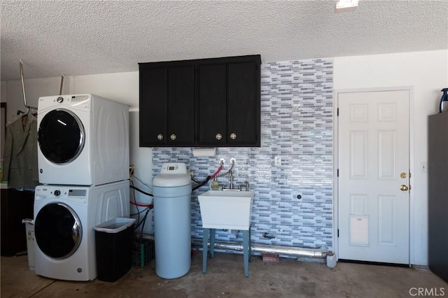 4368 Manchester Ct, Santa Maria, CA 93455 - washroom with stacked washer / dryer, cabinet space, and a textured ceiling
