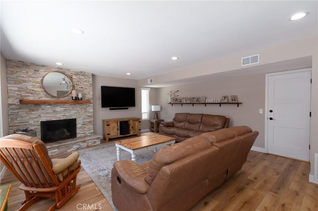 4368 Manchester Ct, Santa Maria, CA 93455 - living area featuring light wood-style flooring, a stone fireplace, and recessed lighting