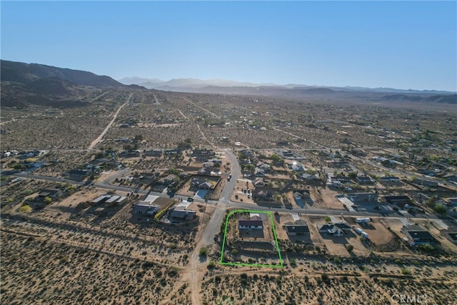 7765 Elwood St, Joshua Tree, CA 92252 - aerial perspective of suburban area featuring property parcel outlined and mountains