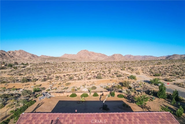7765 Elwood St, Joshua Tree, CA 92252 - view of mountain backdrop featuring a desert landscape and rural landscape