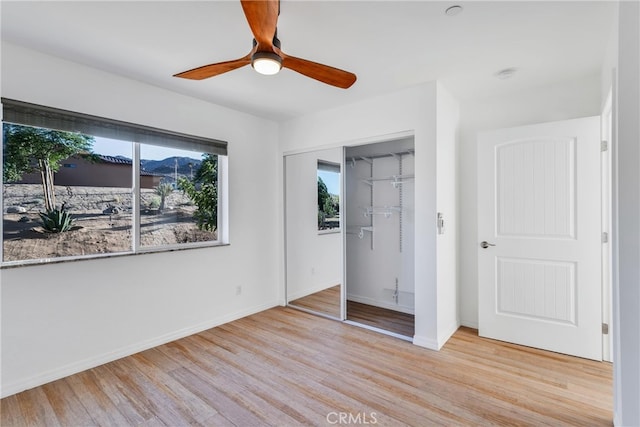 7765 Elwood St, Joshua Tree, CA 92252 - unfurnished bedroom featuring light wood-style floors, a closet, and ceiling fan