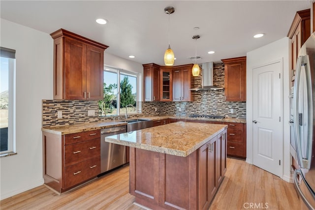 7765 Elwood St, Joshua Tree, CA 92252 - kitchen featuring stainless steel appliances, wall chimney exhaust hood, light wood finished floors, backsplash, and recessed lighting