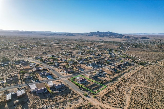 7765 Elwood St, Joshua Tree, CA 92252 - aerial overview of property's location featuring a mountain backdrop and nearby suburban area