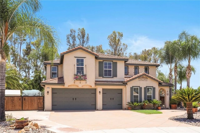 22760 Shadygrove Ct, Wildomar, CA 92595 - mediterranean / spanish-style home with an attached garage, driveway, a tiled roof, and stucco siding