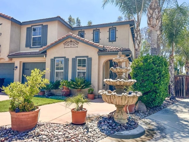 22760 Shadygrove Ct, Wildomar, CA 92595 - mediterranean / spanish-style house featuring a tile roof, stucco siding, and an attached garage