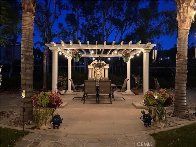 22760 Shadygrove Ct, Wildomar, CA 92595 - patio at twilight featuring outdoor dining space, a pergola, and a patio area