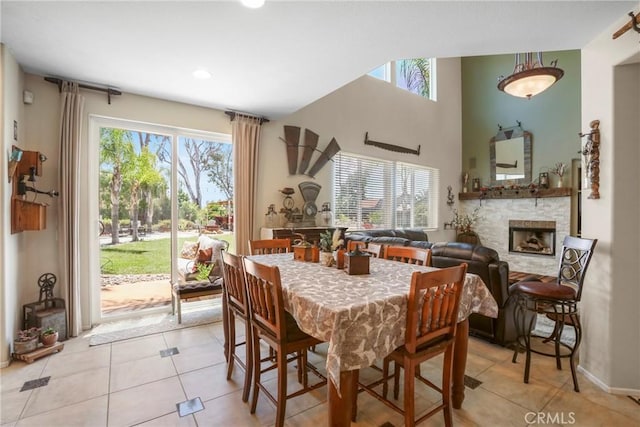 22760 Shadygrove Ct, Wildomar, CA 92595 - dining room with light tile patterned flooring, healthy amount of natural light, a fireplace, and recessed lighting