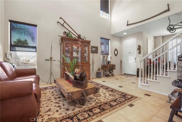 22760 Shadygrove Ct, Wildomar, CA 92595 - tiled living area featuring stairs, plenty of natural light, and a towering ceiling