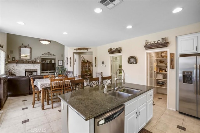 22760 Shadygrove Ct, Wildomar, CA 92595 - kitchen featuring stainless steel appliances, light tile patterned flooring, white cabinetry, a kitchen island with sink, and recessed lighting
